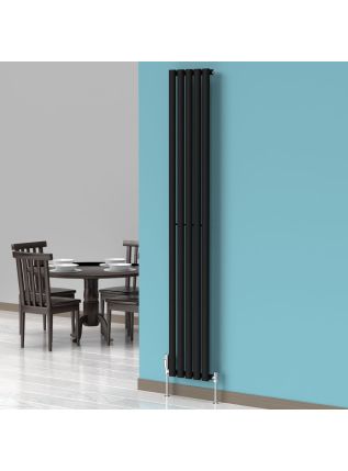 A 1800mm x 300mm Vertical Oval Radiator in a Space Black finish with chrome valves within a dining room setting.