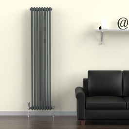 A 1800mm x 380mm Vertical 2-Column Radiator in an Anthracite finish with chrome valves within a living room setting.
