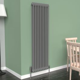 A 1500mm x 470mm Vertical 2-Column Radiator in an Anthracite finish with chrome valves within a living room setting.
