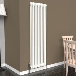 A 1500mm x 470mm Vertical 2-Column Radiator in a White finish with chrome valves within a living room setting.
