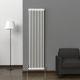A 1800mm x 470mm Vertical 2 Column Radiator in a White finish with chrome valves within a living room setting.
