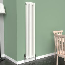 A 1500mm x 290mm Vertical 3-Column Radiator in a White finish with chrome valves within a living room setting.
