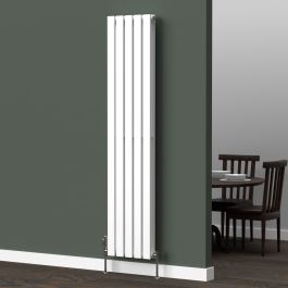 A 1600mm x 350mm flat vertical radiator in a white finish with chrome valves within a kitchen/dining room setting.