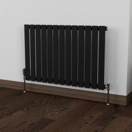 A 600mm x 910mm Flat Single Horizontal Radiator in a Space Black finish with a chrome thermostatic valve in a living room setting.
