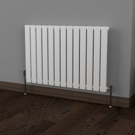 A 600mm x 910mm Flat Single Horizontal Radiator in a White finish with a chrome thermostatic valve in a living room setting.
