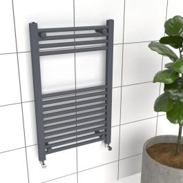 A 800 x 500mm Towel Radiator in a anthracite finish in a bathroom setting with white tiles. 
